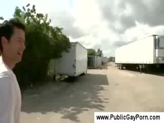 Gay buddy gives a blowjob in public